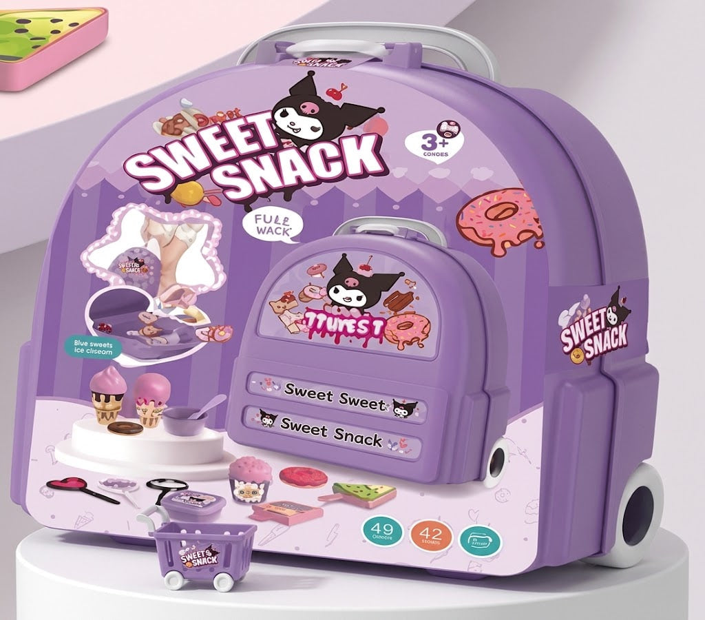 A purple toy playset labeled 'Bow Sweet Snack' with cartoon Kuromi graphics, including a large play case, small accessories, and a shopping cart, displayed on a white pedestal against a pale pink studio background.