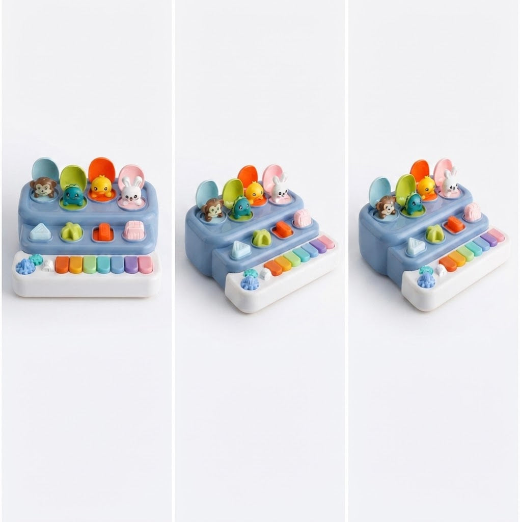 A children's activity toy shown in three views on a white background. The toy has a light blue and white base with colorful keys, small animal figures, and round buttons in multiple bright colors.
