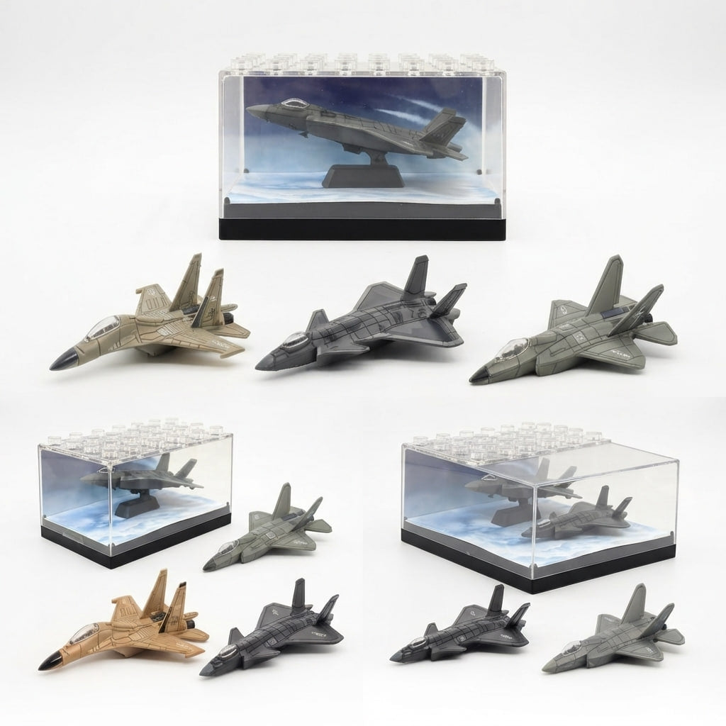 A set of miniature toy fighter jets displayed with clear acrylic display boxes on a white background. The set includes several gray jets and two in tan/sand colors, with some displayed inside clear boxes and others standing outside.