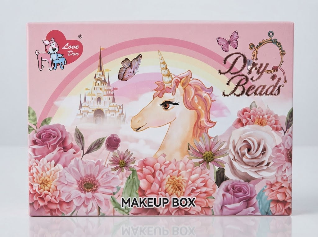 A pink 'Dry Beads' makeup box by Love Box, decorated with a unicorn, castle, butterflies, and pink flowers, shown on a light gray reflective background.