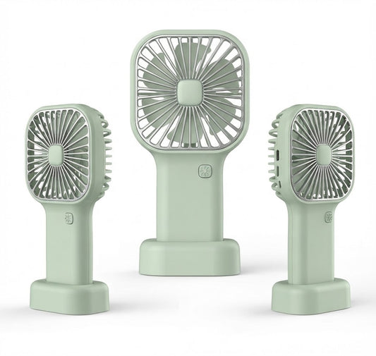 Three portable mini fans in a light sage green color, shown from three different angles (front, back, and side) against a clean white background.