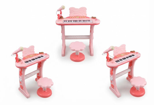 Three pink toy electronic keyboards with matching stools and microphones, arranged on a plain white background.