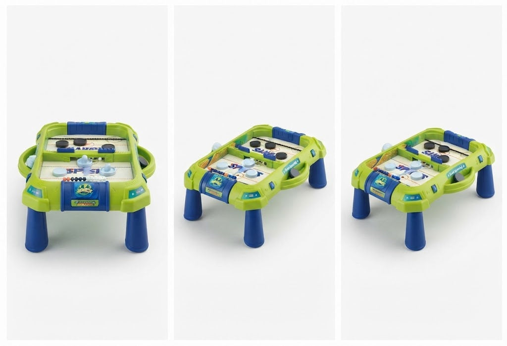 A small toy air hockey table shown from three angles on a light gray background. The table has a lime green frame, blue legs, and a white playing surface with blue and black markings.