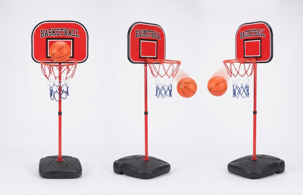 Three mini basketball hoops with red backboards and black bases, shown on a white studio background with two orange basketballs in flight.