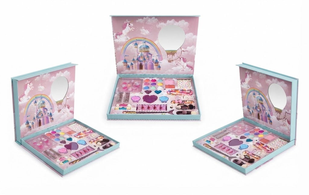 Three views of a children's makeup set in a pastel pink and light blue box with unicorn and castle illustrations. The open boxes show a variety of makeup items including pink and purple eyeshadows, lip colors, and a small mirror.