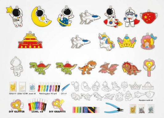 A collage of many small craft/design elements on a white background, including cartoon astronauts, a crescent moon, a rocket, a castle, a unicorn, a crown, dragons, a wand, glitter bottles, markers, a paintbrush, and small accessory pieces. This is not a clean single-product shot and not a person-in-environment lifestyle image, so Product/Packaging does not fit well.