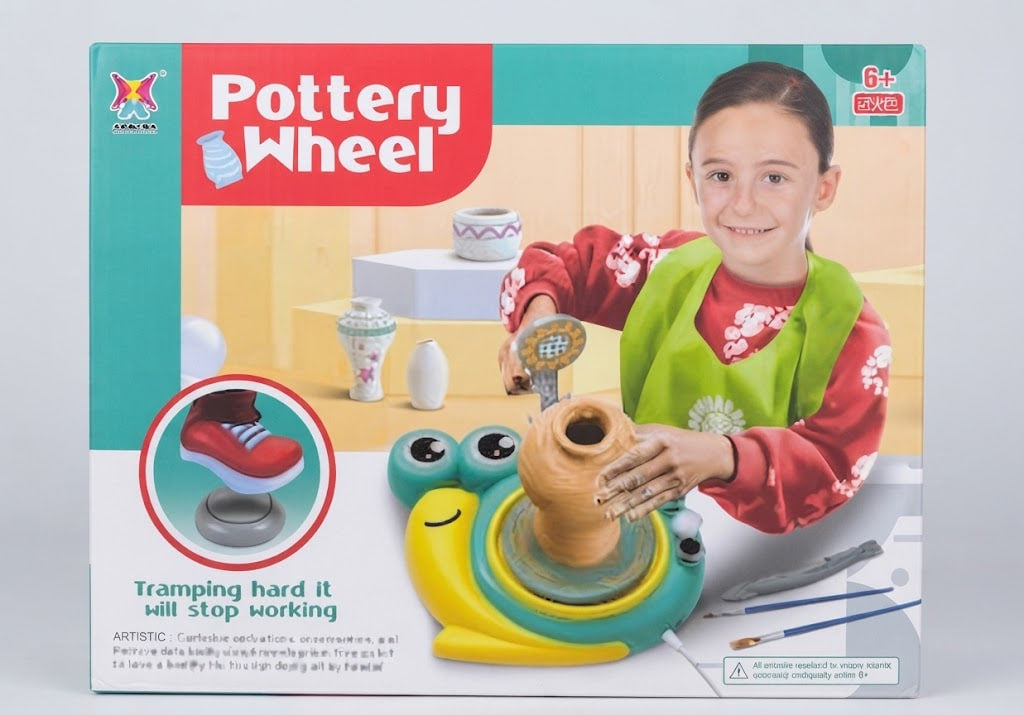 Pottery Wheel toy set in its retail packaging, featuring a child illustration on the box demonstrating the pottery wheel in use.